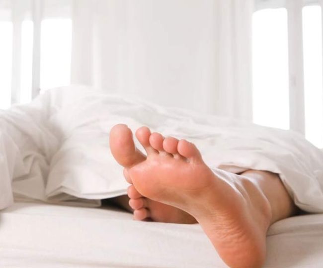 one foot out of blanket