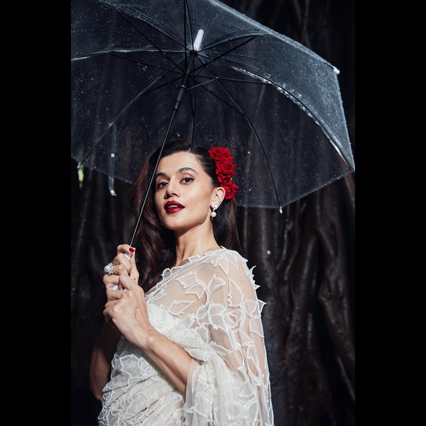 Photo shared by Taapsee Pannu on July 27, 2024 tagging @amandeepkaur87, @hairbyseema, @karishma.joolry, @evaniapannu, @vijitgupta, and @aikeyah. May be an image of 1 person, makeup, parasol and umbrella.