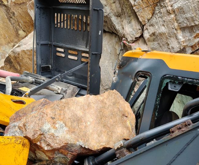 stone fell onto the loader machine